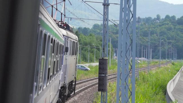 Senic train ride mith mountain in backround during summer. (Slowmotain)