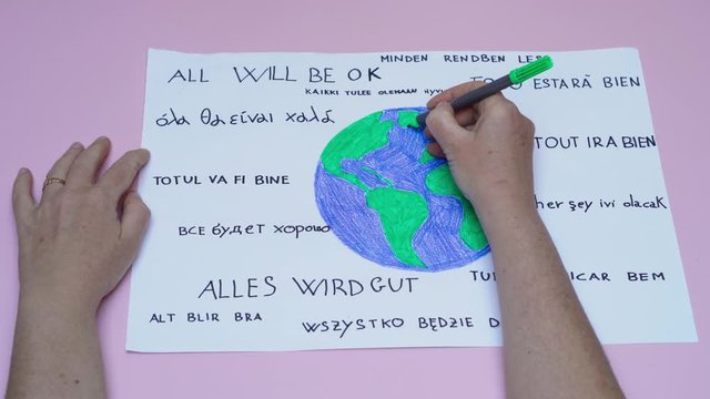 Zoom out of handmade draw about coronavirus and related slogan