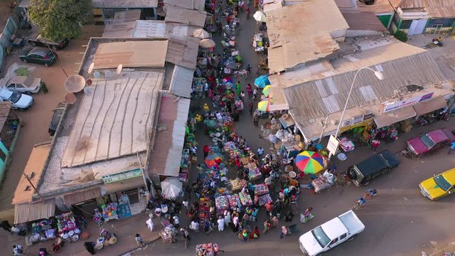 2020 - very good aerial over West African street market in Gambia passes for Guinea, Bissau, Sierra Leone, Nigeria, Ivory Coast or Liberia.