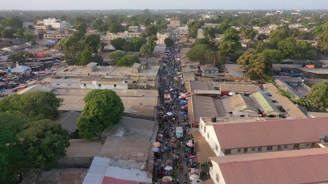 2020 - very good aerial over West African street market in Gambia passes for Guinea, Bissau, Sierra Leone, Nigeria, Ivory Coast or Liberia.