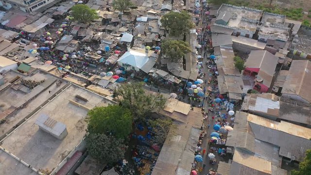 2020 - very good aerial over West African street market in Gambia passes for Guinea, Bissau, Sierra Leone, Nigeria, Ivory Coast or Liberia.