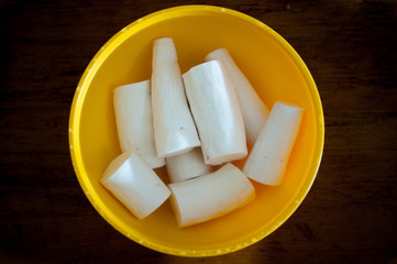 peeled wahoo  on a yellow  bolw with water