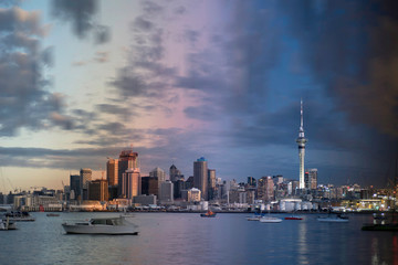 Day to night time slice of the Auckland City skyline running from the afternoon, through sunset, to early evening. View from Northcote Point, across the Waitemata harbour to Auckland, New Zealand.