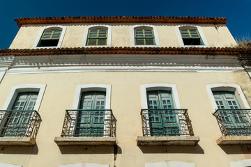 Obraz premium São Luis, Maranhão, Brazil on August 6, 2016. Old facade of the buildings in the historic center, with windows, doors and tiles from the Brazilian colonial period