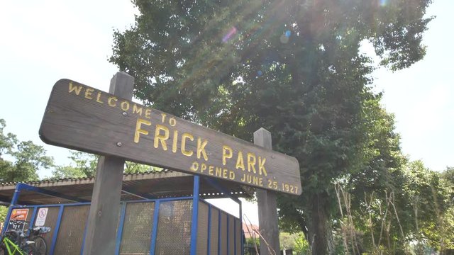 Welcome to Frick Park Entrance Sign, Cinematic Slowmotion Pull Back, Pittsburgh, Pennsylvania USA