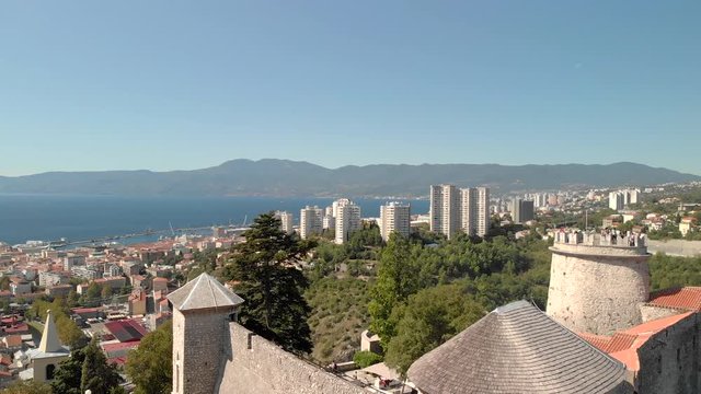 Rising above the medieval Castle parapets of Fort Gradina and The Shrine of Our Lady of Trsat, Rijeka Croatia, aerial