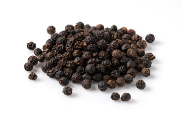 Black pepper placed on a white background