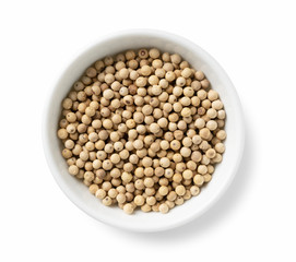 White pepper in a plate placed on a white background
