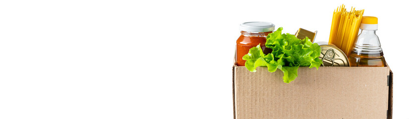 Donation box with food on a white background. Delivery of essential foodstuffs.
