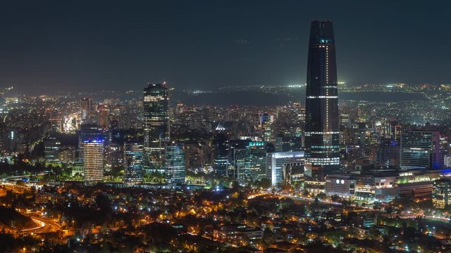 Timelapse view of Santiago cityscape showing modern buildings in the financial district at night in Chile, South America, zoom in.