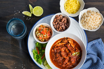 Mexican beef stew with fresh tomato salsa and beans 