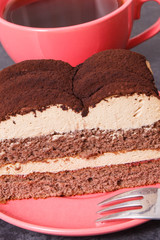 Creamy tiramisu cake with different layers and black coffee. Delicious dessert for celebrations