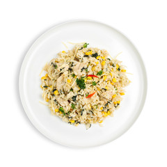 A bowl of Chicken and corn risotto with spinach topped with grated Parmesan Cheese isolated on white