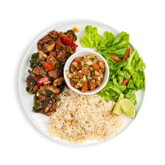 A bowl of Spicy Beef stew with mushrooms, capsicum and vegetables served with a tomato salsa and flat bread isolated on white 