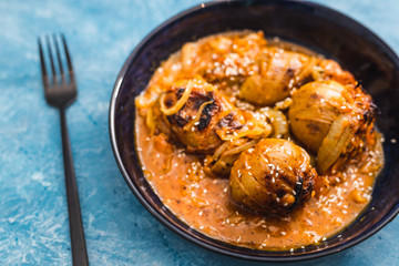 plant-based food, baked potatoes with creamy vegan onion and carrot sauce