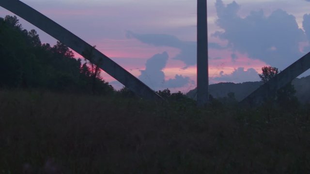 CU TRACKING sunset storm skybridge slow motion fireflies