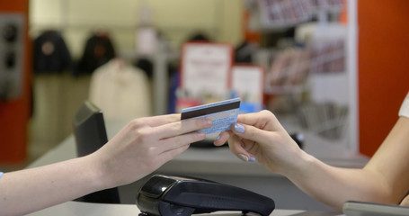 Two young female friends in a shopping, making fun.