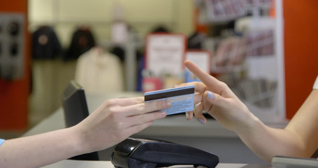 Two young female friends in a shopping, making fun.