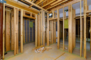 Fototapeta premium Residential home beams framing stick basement unfinished under construction