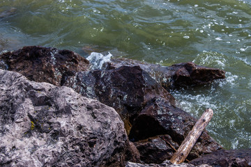 rocks getting hit by waves