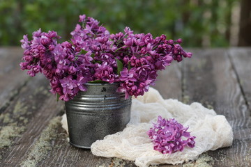 bouquet of lilac flowers in a bucket