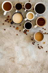 Coffee addiction. Many of cups on hrey table top view space for text