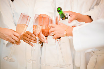 hands holding glasses of champagne