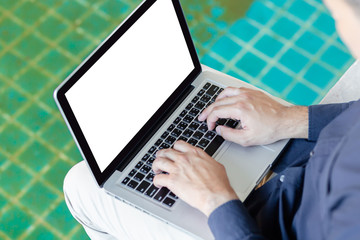 hand close up young asia business man, Happy young man working on laptop,at his working from home,Mock up copy space,Beside the pool