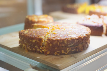 Almond cake on a counter at a cafe 