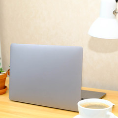 Labtop on wooden table, work from home concept