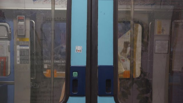 Young woman in a subway car in Paris
