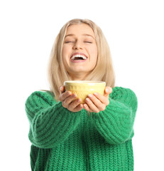 Beautiful young woman with tea on white background