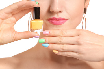 Young woman with beautiful manicure and nail polish on white background, closeup
