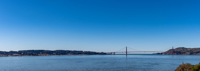 Panorama shot of the San Francisco California Downtown Skyline and Golden Gate Bridge from Alcatraz viewing deck