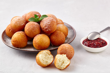 Beautiful breakfast. Cottage cheese donuts  balls  on a light background.