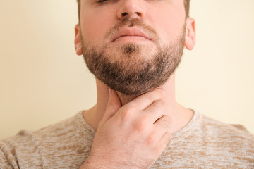 Naklejka premium Man Touching Throat Due to Pain