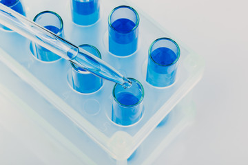 A pipette that adds fluid to one of several tubes. Lab tests