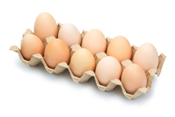  chicken eggs in an open cardboard box with eggs isolated on white. Fresh chicken eggs background.