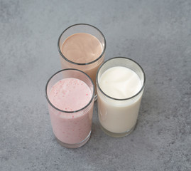 Assorted protein cocktails with fresh fruits, berries and chocolate. Protein shake.