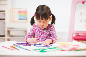 toddler girl practice drawing different shapes  for homeschooling