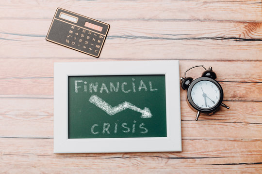 charts of economics and stock markets on a chalk board. financial crisis concept.