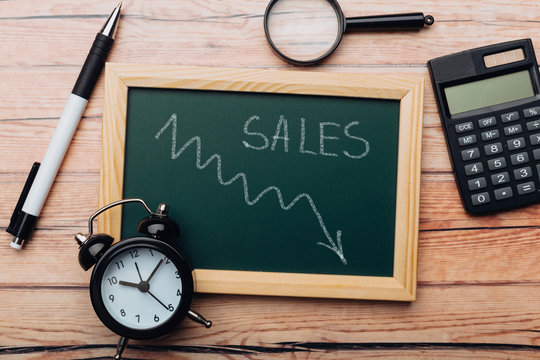 charts of economics and stock markets on a chalk board. financial crisis concept.