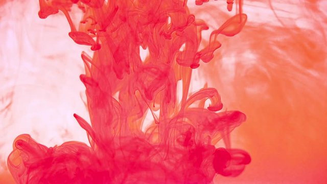 Red color ink drop in water. Slow Movement background liquid and smoke dynamic blend