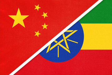 China or PRC vs Ethiopia national flag from textile. Relationship between Asian and African countries.