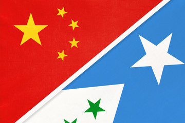 China or PRC vs Galmudug national flag from textile. Relationship between Asian and African countries.