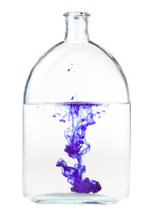 violet ink dissolves in water in bottle isolated