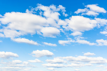 Naklejka na ściany i meble blue sky with many white cumuli clouds