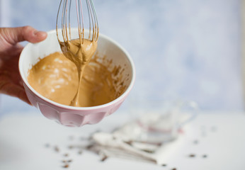 Cooking iced Dalgona coffee. Trendy fluffy creamy whipped coffee.