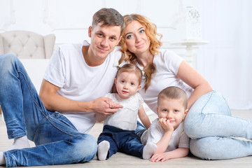 happy family sitting on the floor