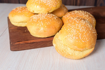 Burger rolls on a wooden background. copycpase . close-up.